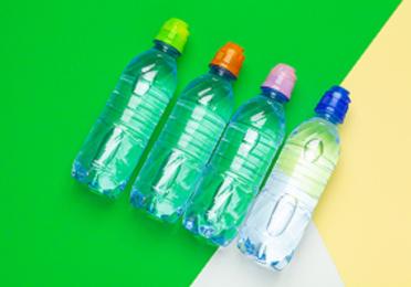 plastic water bottles with caps of different colour